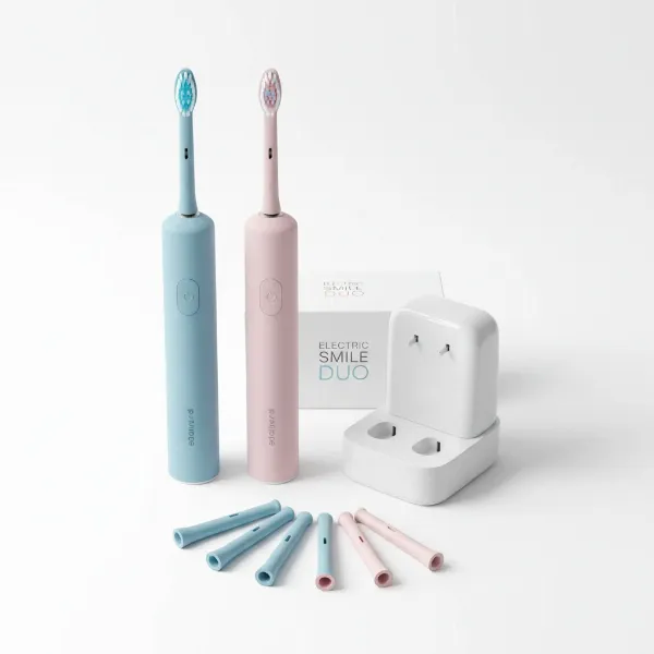 An electric toothbrush family pack designed for couples with two handles and multiple brush heads