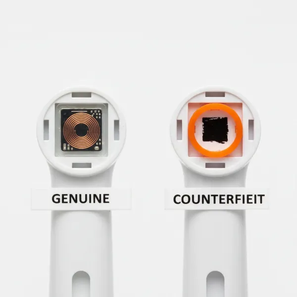 Visual comparison of genuine Sonicare brush head with visible RFID chip and a fake imitation.